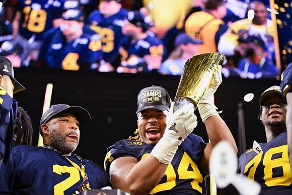 Kris Jenkins (94), Kenneth Grant (78), and National Championship Trophy
