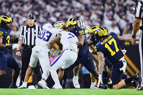 Jaylen Harrell (32), Cam Goode (99), and Braiden McGregor (17)