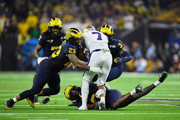 Makari Paige (7), Michael Barrett (23), Keon Sabb (3), and Mike Sainristil (0)
