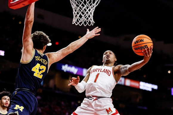Olivier Nkamhoua (13) and Will Tschetter (42)