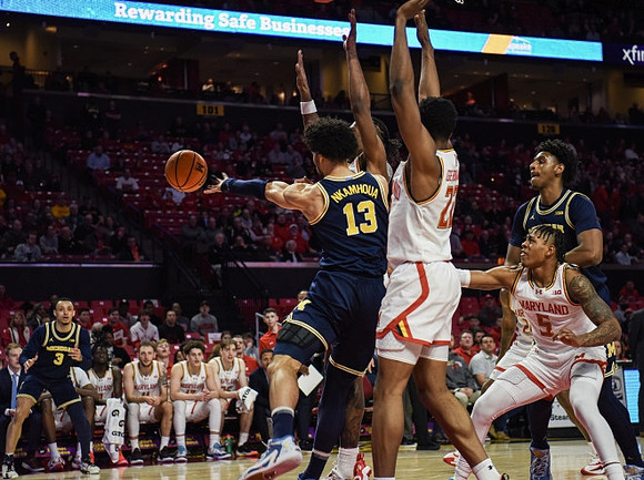 Tray Jackson (2), Olivier Nkamhoua (13), and Tarris Reed Jr. (32)