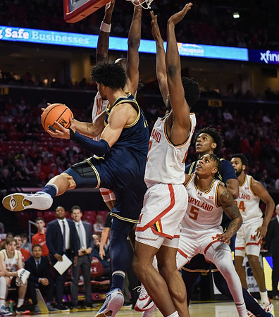 Olivier Nkamhoua (13) and Tarris Reed Jr. (32)