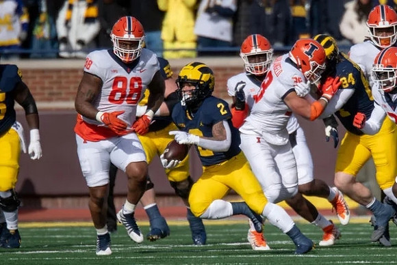 Blake Corum (2) and Joel Honigford (84)
