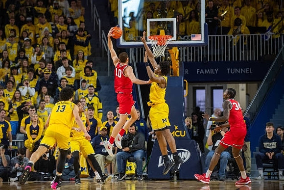 Olivier Nkamhoua (13), Dug McDaniel (0), and Tarris Reed Jr. (32)