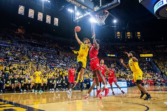 Dug McDaniel (0), Olivier Nkamhoua (13), and Tarris Reed Jr. (32)