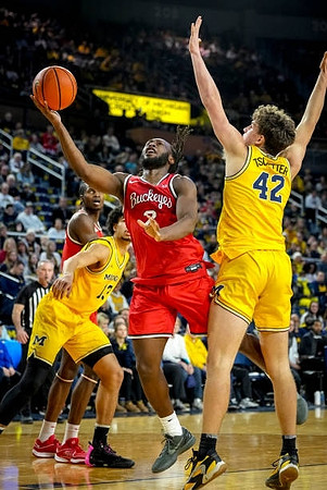 Olivier Nkamhoua (13) and Will Tschetter (42)