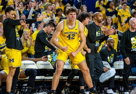 Will Tschetter (42) and Michigan Team
