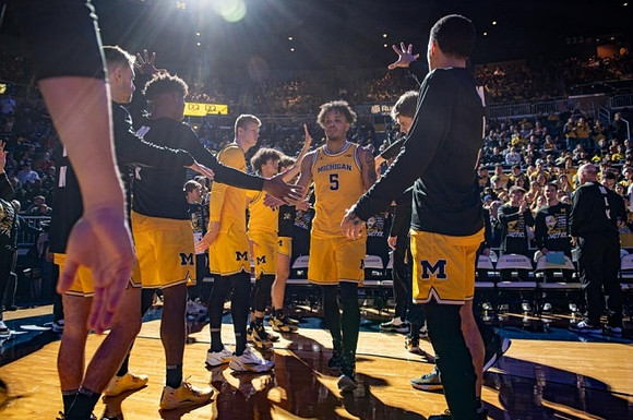 Terrance Williams II (5) and Michigan Team