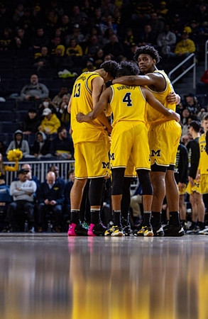 Olivier Nkamhoua (13), Nimari Burnett (4), and Tarris Reed Jr. (32)