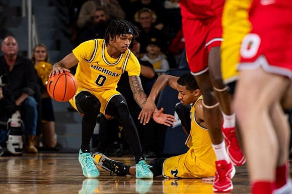 Dug McDaniel (0) and Nimari Burnett (4)