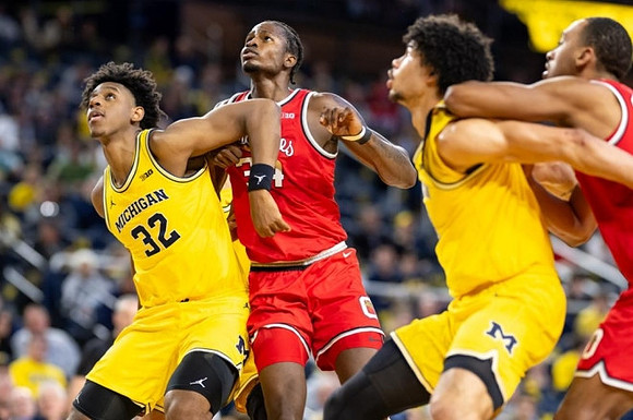 Tarris Reed Jr. (32) and Olivier Nkamhoua (13)