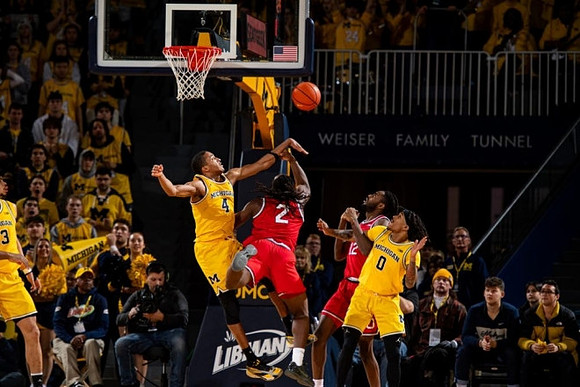 Olivier Nkamhoua (13), Nimari Burnett (4), and Dug McDaniel (0)