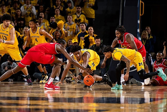 Olivier Nkamhoua (13), Nimari Burnett (4), Tarris Reed Jr. (32), and Dug McDaniel (0)