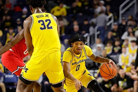 Tarris Reed Jr. (32) and Dug McDaniel (0)