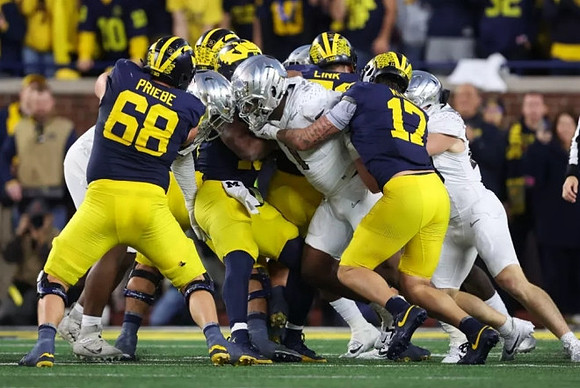 Josh Priebe (68), Donovan Edwards (7), and Evan Link (71)