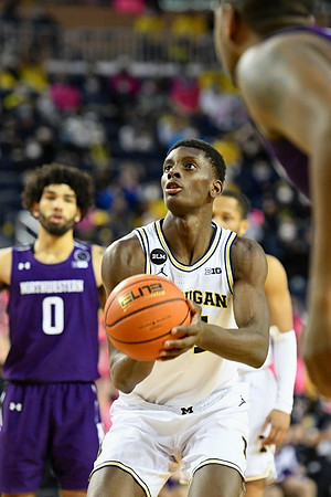 Moussa Diabate (14) and DeVante' Jones (12)