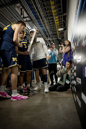 Will Tschetter (42), Tre Donaldson (3), and Michigan Team