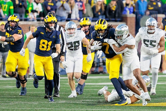 Evan Link (71), Peyton O'Leary (81), and Donovan Edwards (7)