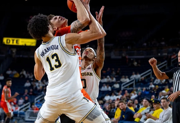 Olivier Nkamhoua (13) and Dug McDaniel (0)