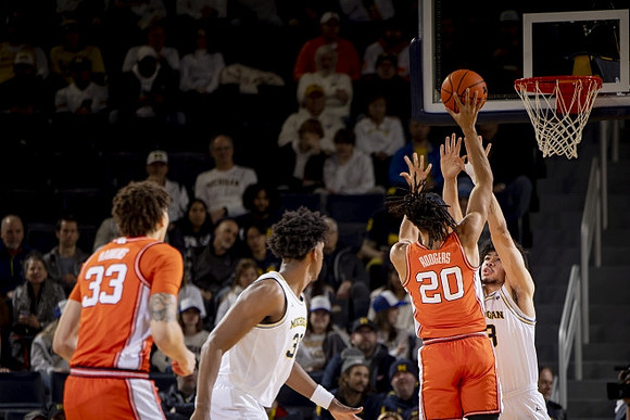 Tarris Reed Jr. (32) and Olivier Nkamhoua (13)
