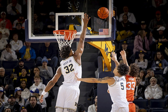 Tarris Reed Jr. (32) and Terrance Williams II (5)
