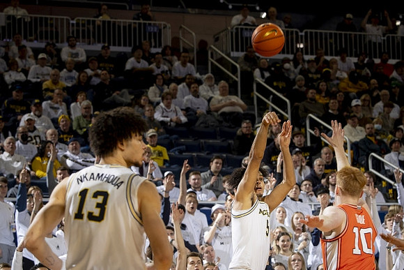 Terrance Williams II (5) and Olivier Nkamhoua (13)