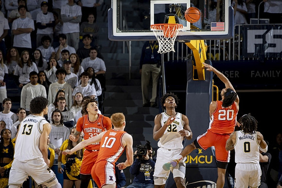 Olivier Nkamhoua (13), Tarris Reed Jr. (32), and Dug McDaniel (0)