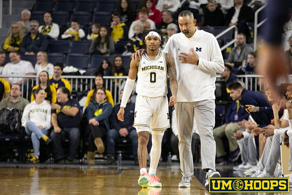 Dug McDaniel (0) and Juwan Howard