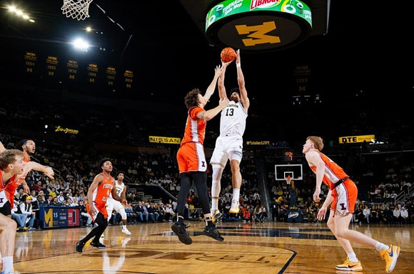 Jace Howard (25) and Olivier Nkamhoua (13)