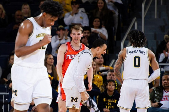 Tarris Reed Jr. (32), Jaelin Llewellyn (3), and Dug McDaniel (0)