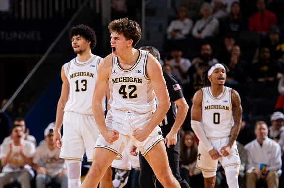 Olivier Nkamhoua (13), Will Tschetter (42), and Dug McDaniel (0)