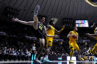 Tarris Reed Jr. (32), Olivier Nkamhoua (13), and Nimari Burnett (4)