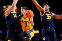 Olivier Nkamhoua (13) and Tarris Reed Jr. (32)