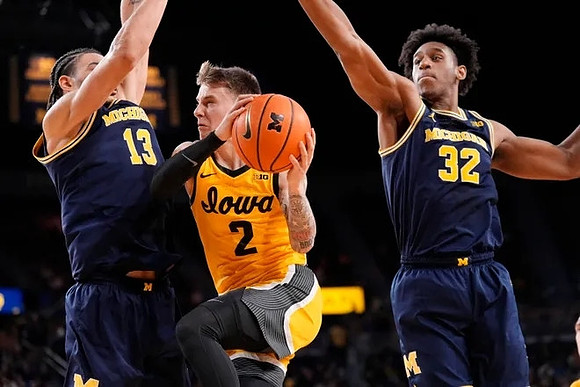 Olivier Nkamhoua (13) and Tarris Reed Jr. (32)