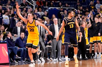 Olivier Nkamhoua (13) and Iowa Head Coach Fran McCaffery