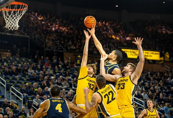 Nimari Burnett (4) and Olivier Nkamhoua (13)