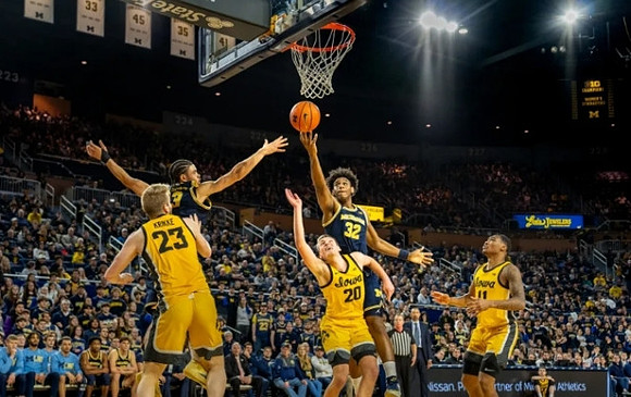 Olivier Nkamhoua (13) and Tarris Reed Jr. (32)