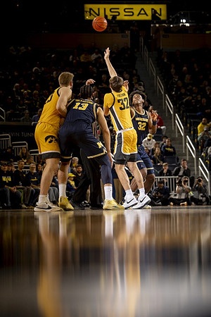 Olivier Nkamhoua (13) and Tarris Reed Jr. (32)