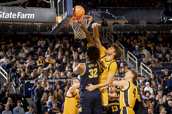 Tarris Reed Jr. (32) and Olivier Nkamhoua (13)