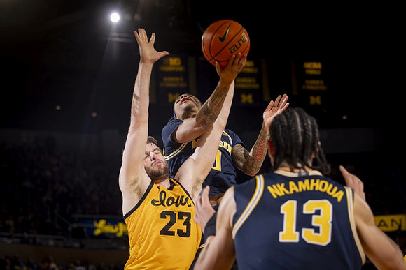Dug McDaniel (0) and Olivier Nkamhoua (13)