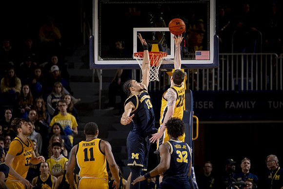 Olivier Nkamhoua (13) and Tarris Reed Jr. (32)
