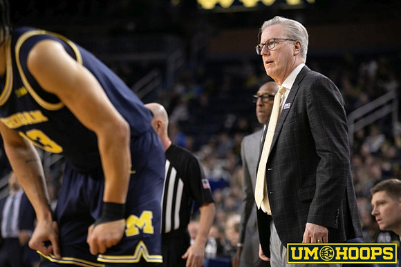 Olivier Nkamhoua (13) and Iowa Head Coach Fran McCaffery