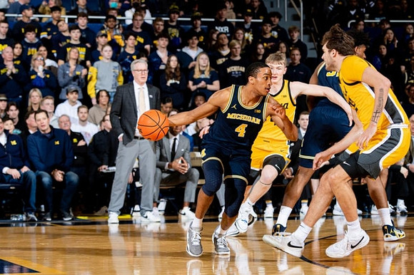 Iowa Head Coach Fran McCaffery, Nimari Burnett (4), and Tarris Reed Jr. (32)