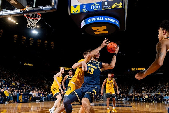 Tarris Reed Jr. (32) and Olivier Nkamhoua (13)