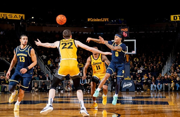 Olivier Nkamhoua (13) and Dug McDaniel (0)