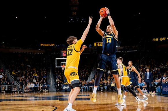 Olivier Nkamhoua (13) and Nimari Burnett (4)