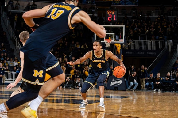 Olivier Nkamhoua (13) and Nimari Burnett (4)