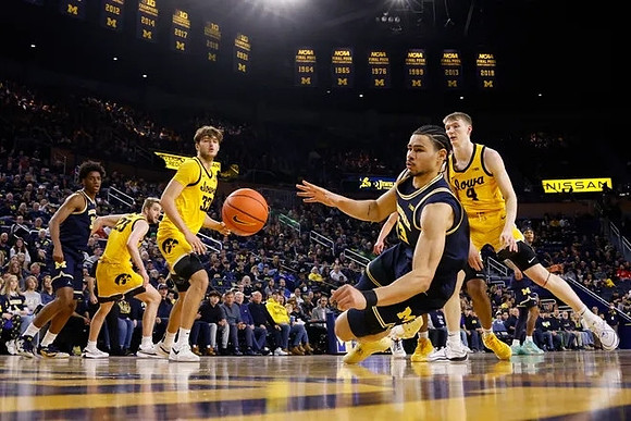 Tarris Reed Jr. (32) and Olivier Nkamhoua (13)