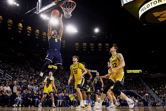 Terrance Williams II (5), Tarris Reed Jr. (32), and Olivier Nkamhoua (13)