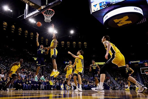 Dug McDaniel (0), Tarris Reed Jr. (32), and Olivier Nkamhoua (13)